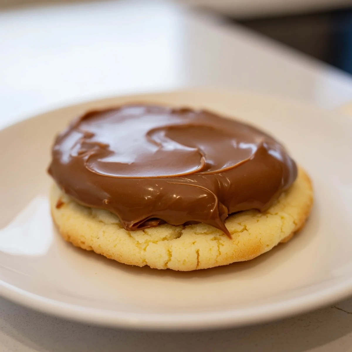 Golden-brown Twix Cookies with buttery shortbread bases, topped with glossy caramel and smooth milk chocolate layers. 
