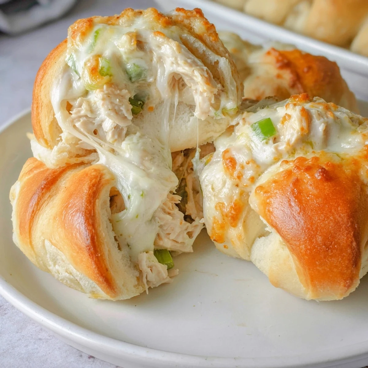Golden brown cheesy chicken crescent bake with bubbling cheese filling and flaky pastry crust