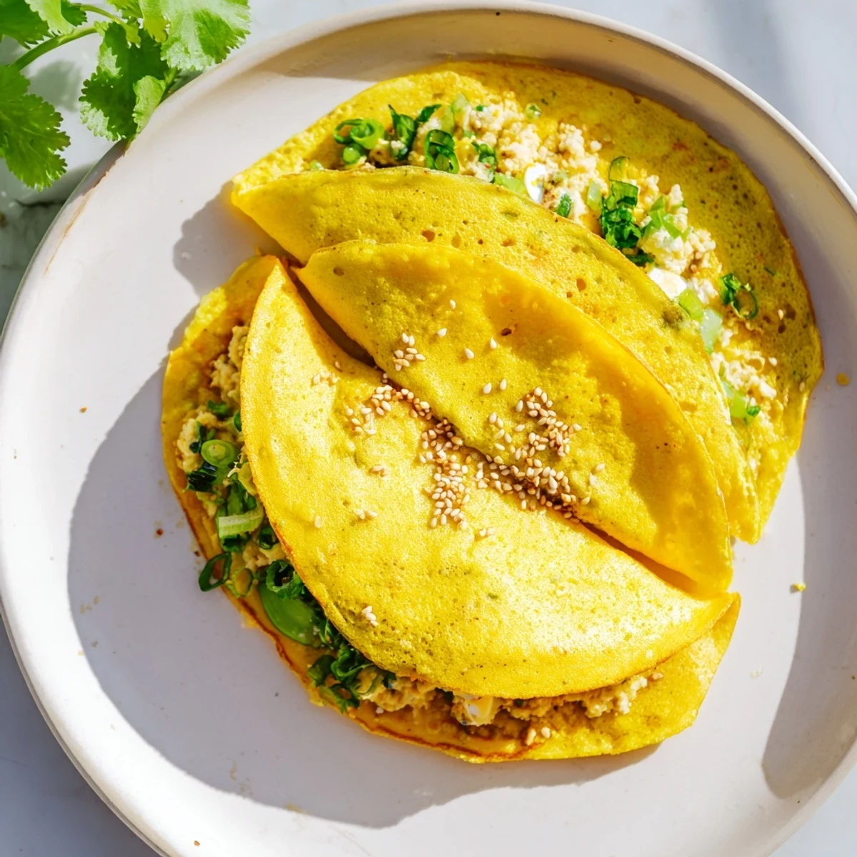 Golden Mont Lin Ma Yar pancakes filled with quail eggs and chickpeas in a takoyaki pan