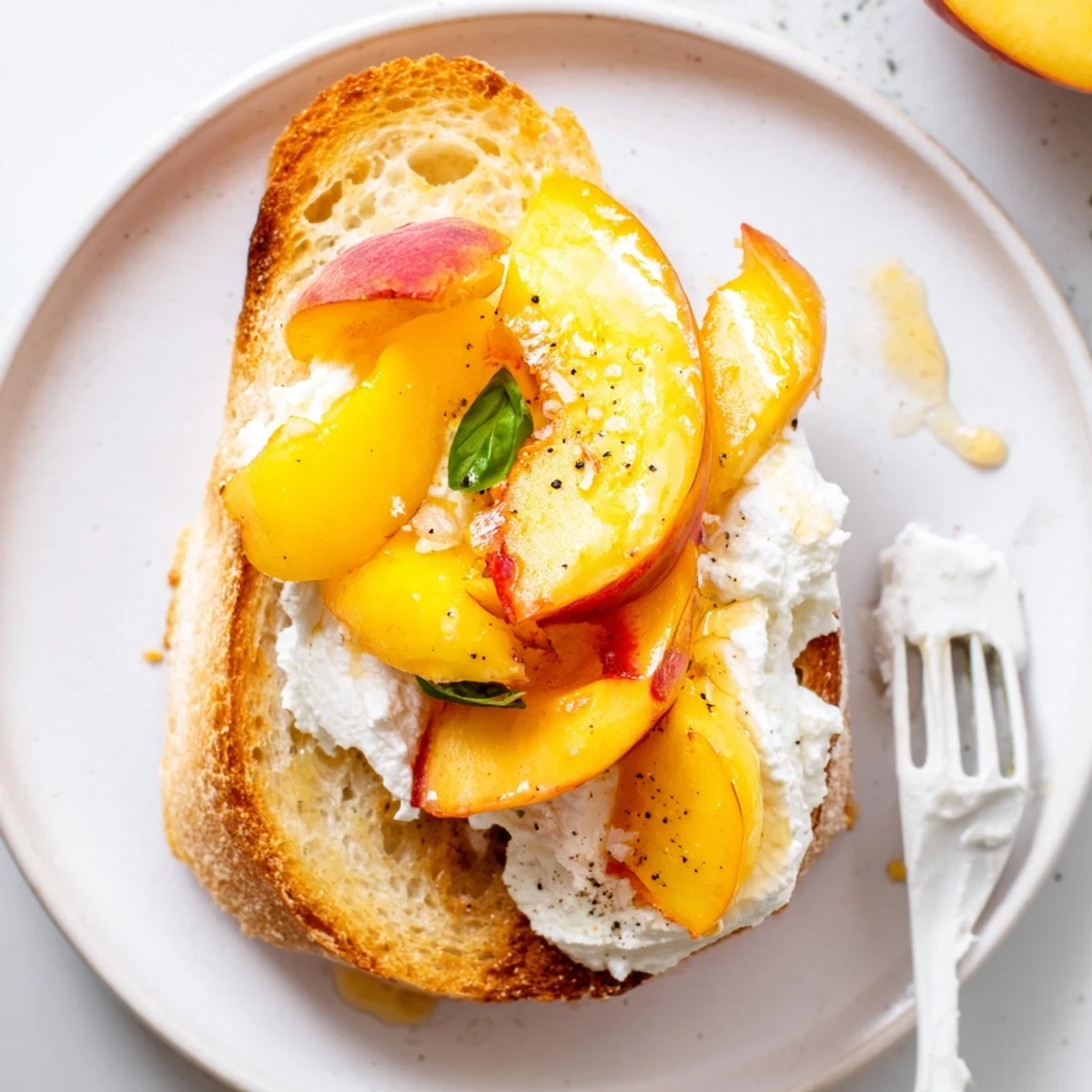 Summer appetizer Peach Bruschetta With Whipped Ricotta, lemon-zested whipped spread, crisp toast
