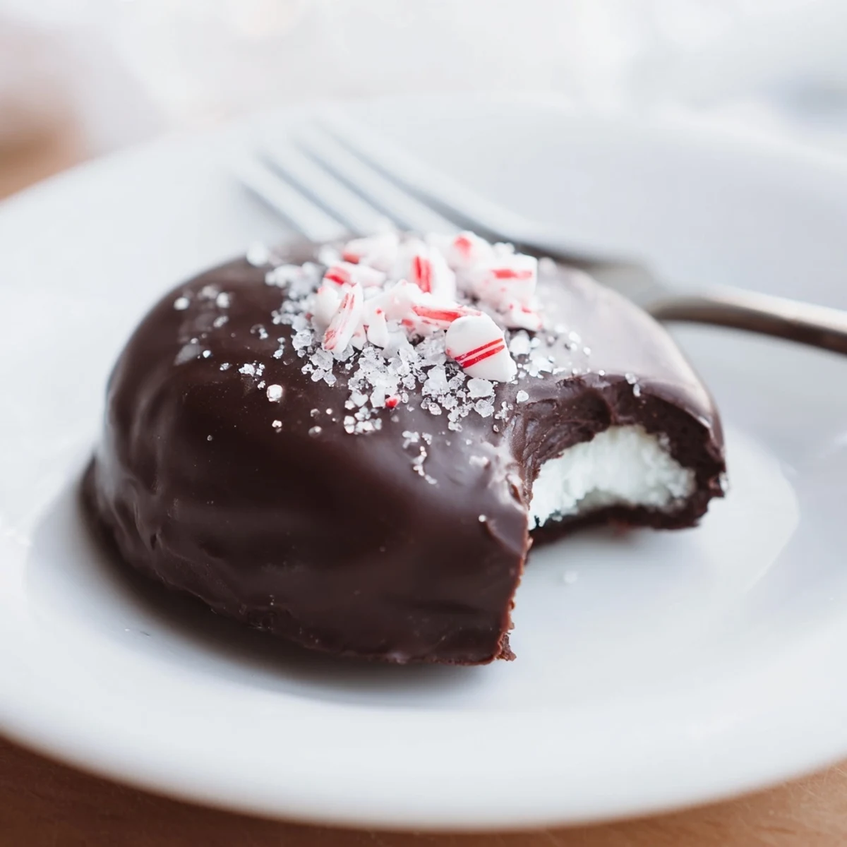 Peppermint Patties arranged on parchment, glossy dark chocolate and cool mint centers