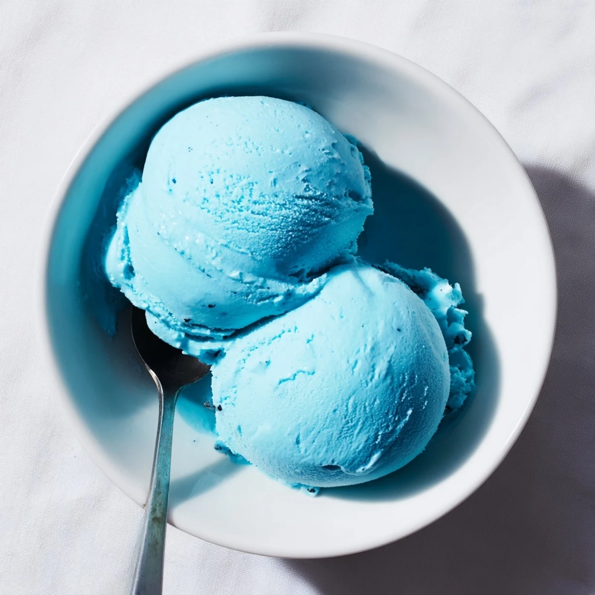 Smooth bright blue moon ice cream swirling softly in a frozen summer dessert