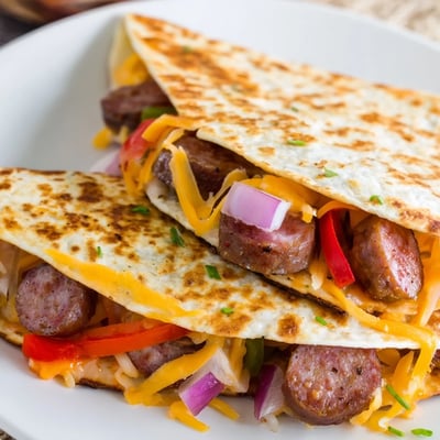 Cajun Beef Sausage Quesadillas With Melty Cheese Recipe: crisp tortilla, spicy sausage, molten cheese.